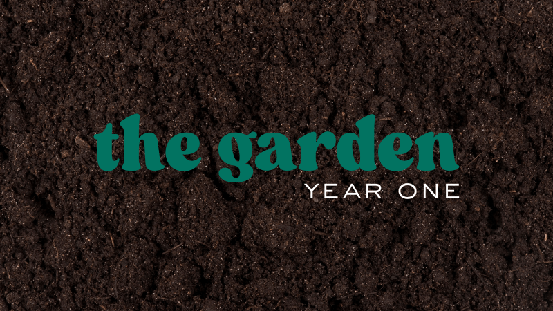 On a background of dark brown soil, the graphic reads, "The Garden: Year One."